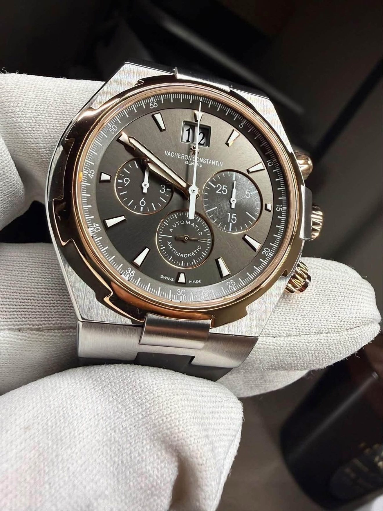 Vacheron Constantin Overseas Chronograph 49150 limited edition with brown dial and rose-gold bezel held in a white glove
