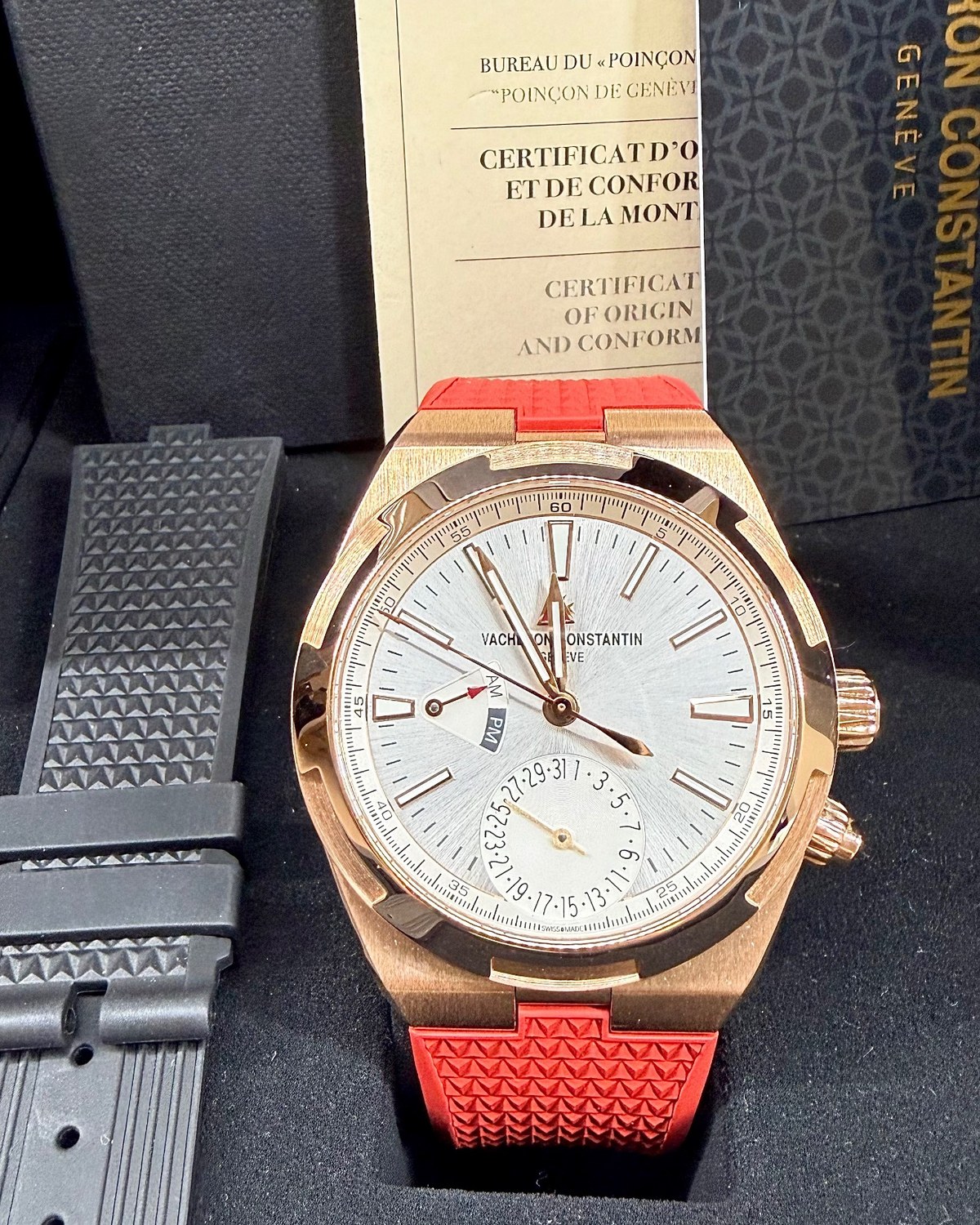 2020 rose-gold Vacheron Constantin Overseas Dual Time 7900V with a silver dial and red strap